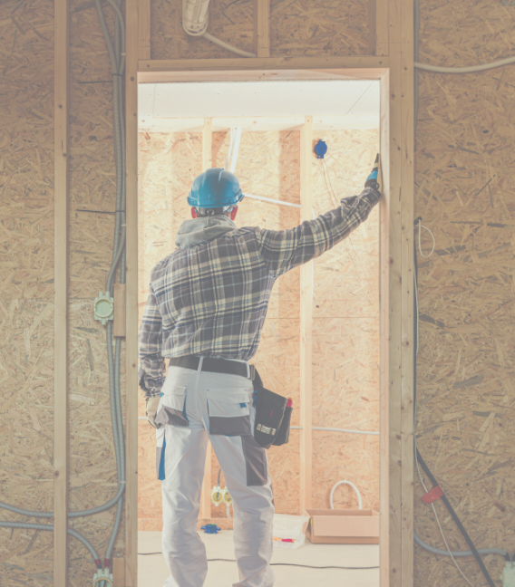 construction worker inside house frame