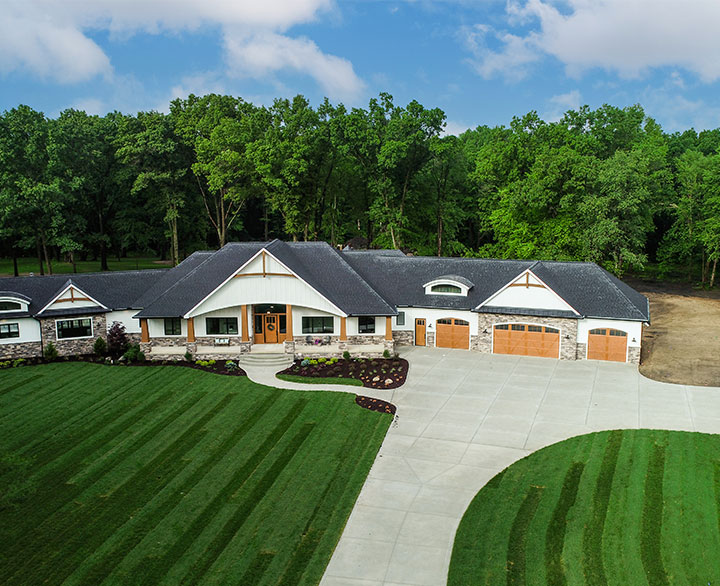 drone view of home and property